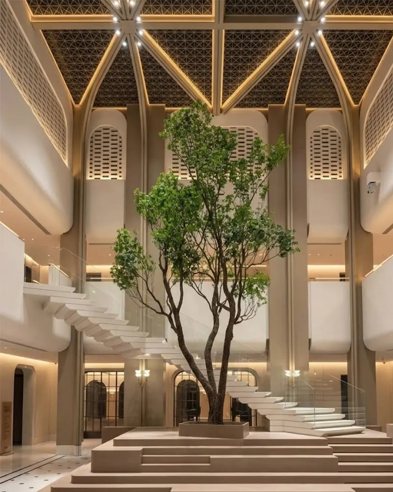 Completed ultra-realistic large indoor artificial banyan tree centerpiece for a premium architectural space.