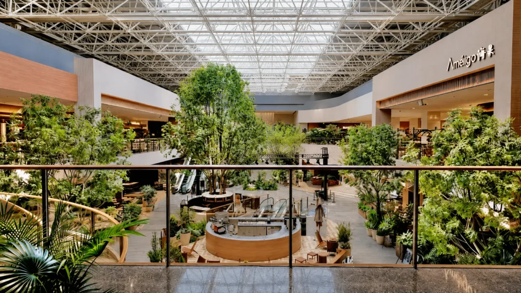 Custom artificial trees installed in a commercial atrium for a large indoor landscape project