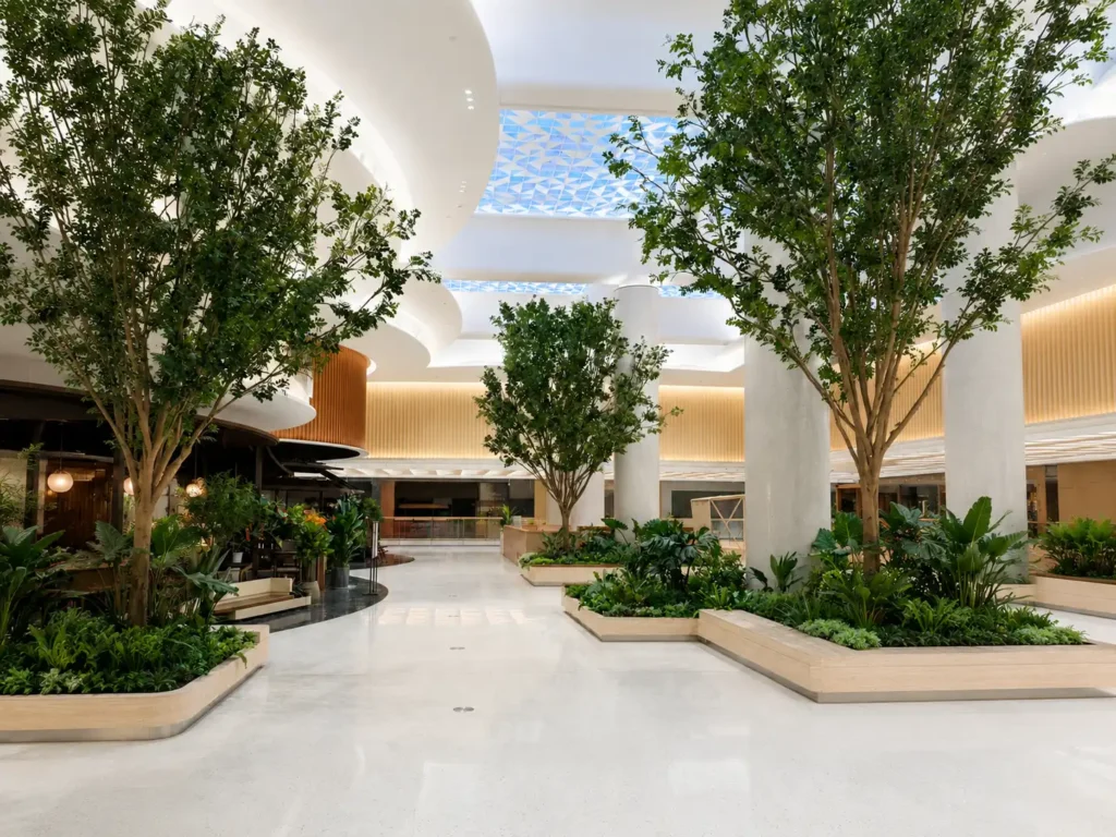 Finished artificial tree installation in commercial atrium interior