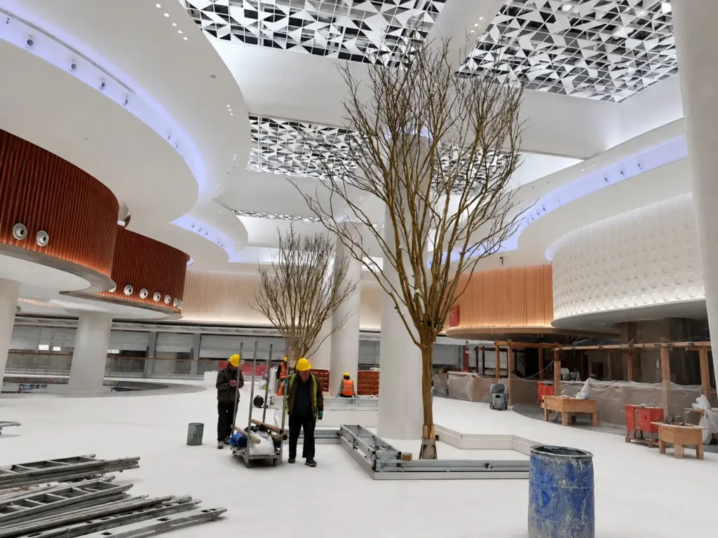 On-site assembly of artificial trees for shopping mall atrium project